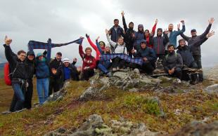 Staff and students from the Edinburgh Fire Research Centre gathered atop a mountain
